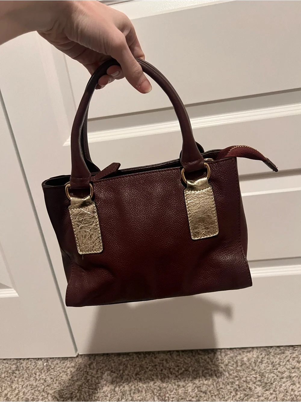 Classic Burgundy Pebbled Leather Satchel with Gold Accents